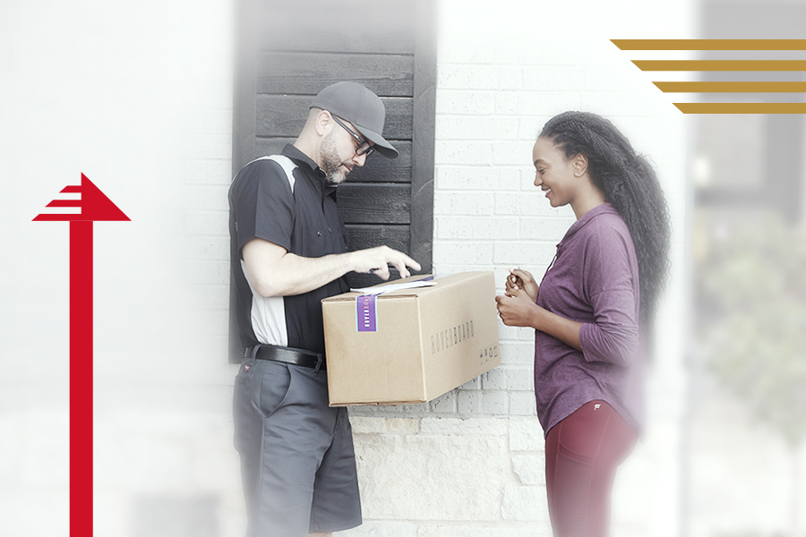 A customer receiving their order at their doorstep, the end result of a pick and pack system