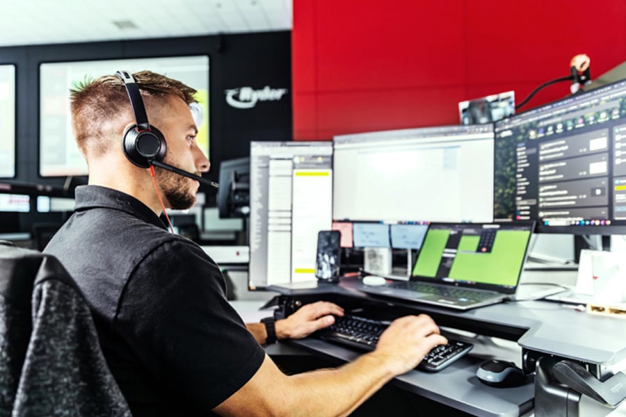 employee with laptop at a solutions center