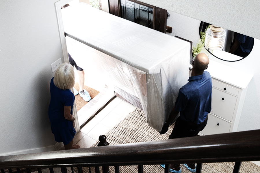 Ryder employees managing reverse logistics by helping a customer with their return
